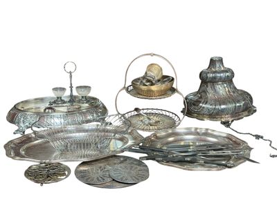 a lot of silver items that are sitting on the table