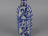 blue and white vase with a decorative design on the outside