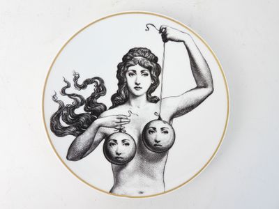 a drawing of a woman holding two balls in her hands