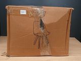 a cardboard box with a drawing of a chair on it