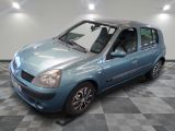 a picture of a small blue car parked in a garage