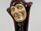 an image of a sculpture of a man with a smile on his face