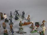 many figurines of different types and sizes on the table