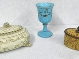 three different types of vases sitting on a white surface