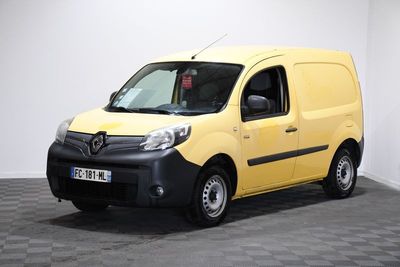 the yellow van is parked in a white room with a checkered floor