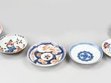 several different types of bowls are arranged on a table