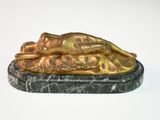 statue of a sleeping woman on a marble base