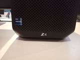 an image of a small black speaker on a table