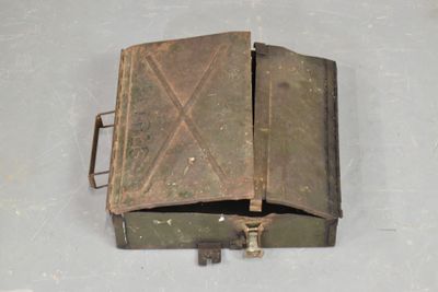 a small metal box with a key in it