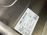 a picture of a stainless steel sink with a ticket attached to it