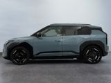 the blue suv is parked on the concrete floor in the room