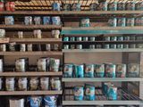 many cans of food on the shelves in the store