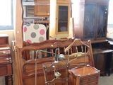 a room with a piano, chair, and other furniture