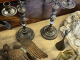 many different types of candles that are on the table