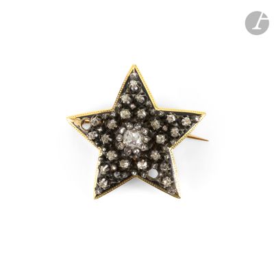 an image of a gold and diamond star broochle