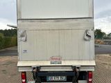 a white truck that is parked on the side of the road