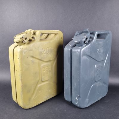 two yellow and gray jerry cans sitting side by side on a gray background