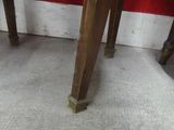 a small wooden table with a clock on top of it