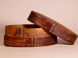 two pieces of wood are stacked on top of each other