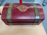 a red box with a gold design on it