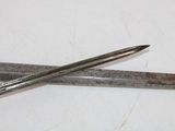 a pair of scissors sitting on a table next to each other