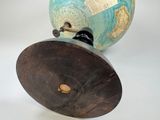 a blue and brown vase with a map on it