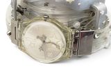 a watch that is sitting on top of a bracelet