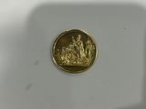 a gold coin with a picture of a man and a woman on it