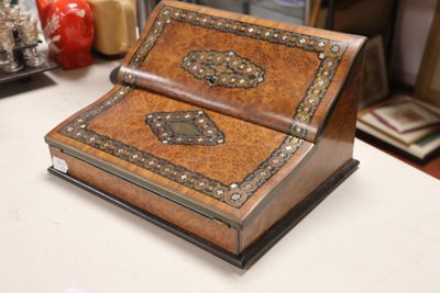 a small wooden box sitting on a counter in a room