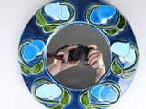 a person taking a picture of themselves in a mirror