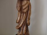 a statue of a man holding a woman on his back