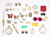 many different types of jewelry on a white surface