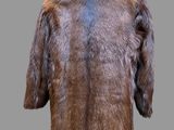 the back of a brown fur jacket with a fur collar