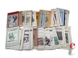 a lot of books that are stacked on top of each other
