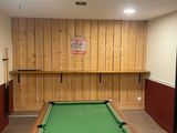 a pool table in the middle of the room