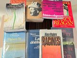 a lot of books that are sitting on a table