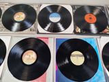 a lot of vinyl records sitting on a table
