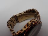 an image of a close up of a watch on a white surface