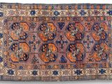 an old rug with many different colors and patterns
