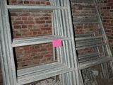 a pile of wood and a ladder in a room