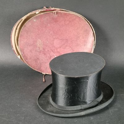 a black top hat sitting on top of a black hat