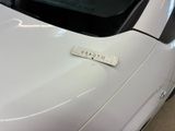 a sticker on the hood of a white car