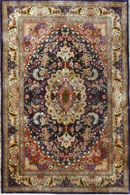 a black and red rug with a medallion design on it