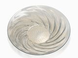 a glass plate with a silver swirl on it