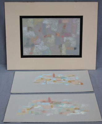 two paintings that are on the table next to each other