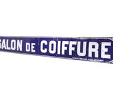 blue and white street sign with the words salon de coiffure on it