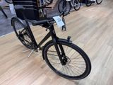 a black bicycle that is on display in a store