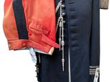 an image of a military uniform on a mannequin with a red and blue jacket