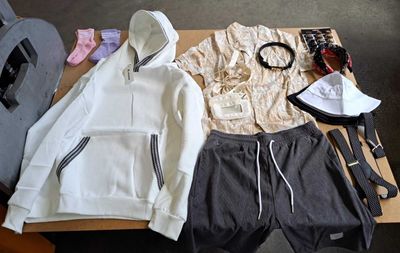 a table with a bunch of clothing on it