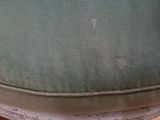 a close up of a chair with a seat cushion